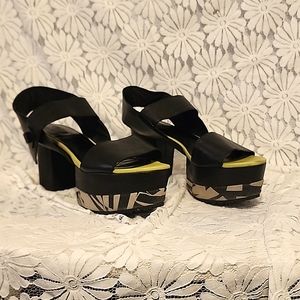 Matiko platform shoes in black leather and lime green leather trim